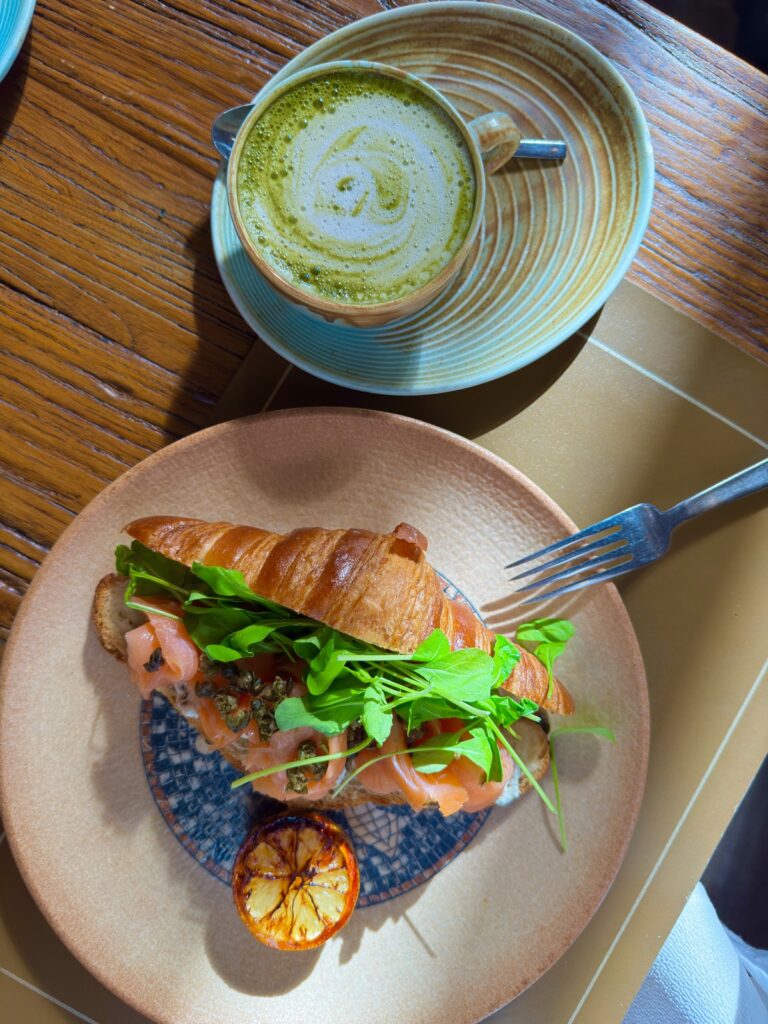 Salmon croissant with microgreens and a matcha latte at Hotel La Compañía breakfast in Casco Viejo, Panama