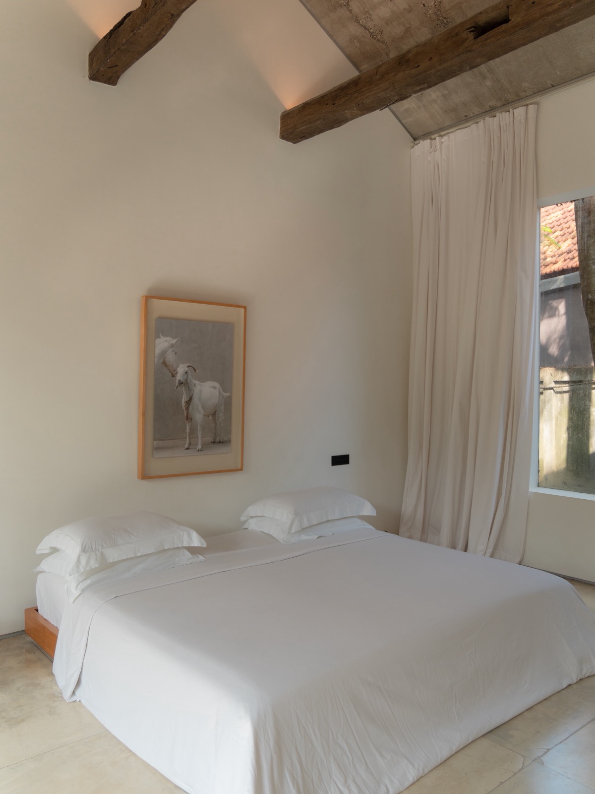 Kore Room bed at Lodge in the Woods in Kaba-Kaba, Bali