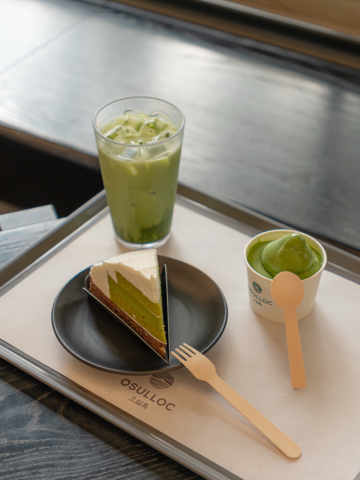 Tray with matcha latte, matcha cheesecake, and matcha ice cream at O Sulloc on Jeju Island