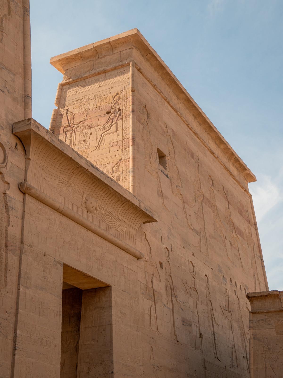 Carved temple pylon and reliefs at Philae Temple in Aswan
